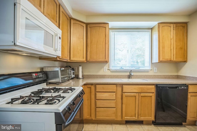 742 Arndt Ave, Riverside, NJ 08075 - kitchen featuring white appliances, a sink, light tile patterned floors, and light countertops