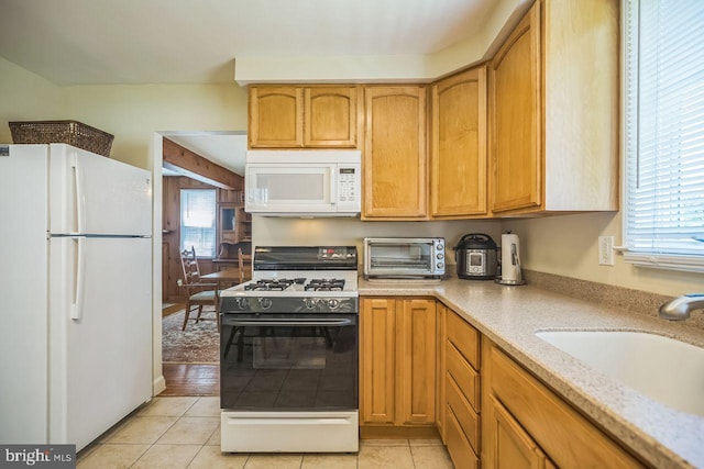 742 Arndt Ave, Riverside, NJ 08075 - kitchen featuring white appliances, a sink, healthy amount of natural light, and light tile patterned flooring
