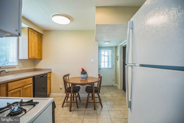 742 Arndt Ave, Riverside, NJ 08075 - kitchen featuring white appliances, a sink, light tile patterned floors, baseboards, and light countertops