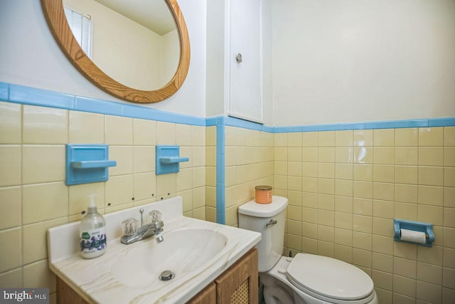 742 Arndt Ave, Riverside, NJ 08075 - bathroom with tile walls, toilet, vanity, and wainscoting