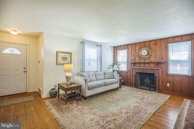 742 Arndt Ave, Riverside, NJ 08075 - living area with wood finished floors, a brick fireplace, and baseboards