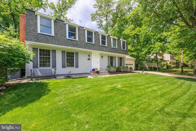 6316 Ferryboat Cir, Columbia, MD 21044 - front of property featuring a front lawn, a garage, driveway, a shingled roof, and mansard roof