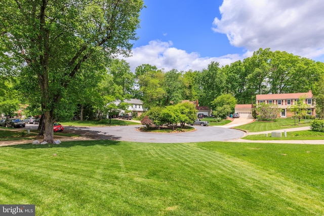 6316 Ferryboat Cir, Columbia, MD 21044 - surrounding community with asphalt driveway and a lawn