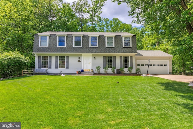 6316 Ferryboat Cir, Columbia, MD 21044 - view of front of house featuring a garage, a shingled roof, concrete driveway, and a front yard