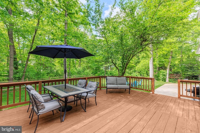 6316 Ferryboat Cir, Columbia, MD 21044 - deck featuring outdoor lounge area, outdoor dining space, and view of scattered trees