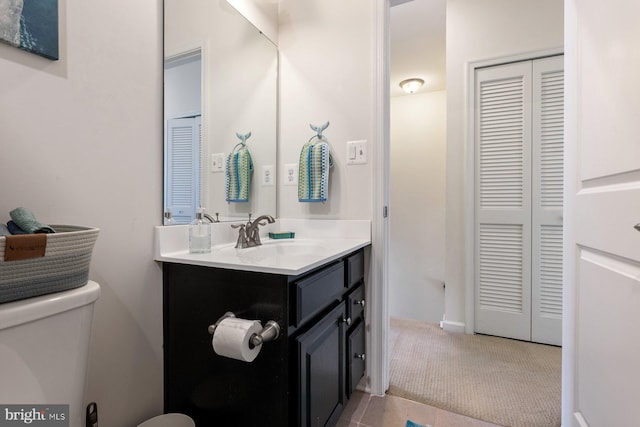 8109 Secluded Cove Ln, Dundalk, MD 21222 - bathroom with toilet, a closet, and vanity