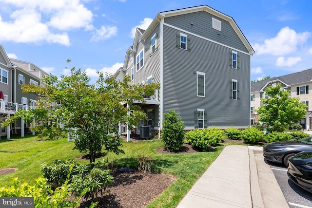 8109 Secluded Cove Ln, Dundalk, MD 21222 - view of property exterior featuring a yard and central air condition unit