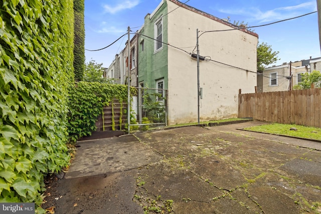 133 W Norris St, Philadelphia, PA 19122 - rear view of property featuring stucco siding