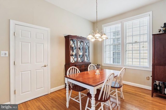 713 Bright Meadow Dr, Gaithersburg, MD 20878 - dining area featuring a chandelier, light wood-style flooring, and healthy amount of natural light