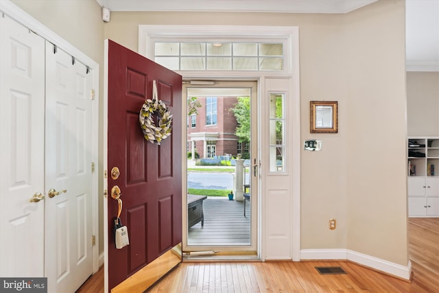 713 Bright Meadow Dr, Gaithersburg, MD 20878 - foyer with light wood-style flooring and crown molding