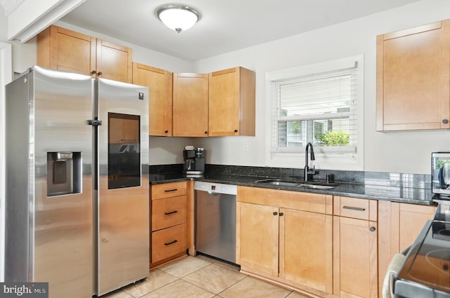 2512 Kitmore Ln, Bowie, MD 20715 - kitchen with appliances with stainless steel finishes, a sink, dark stone countertops, light tile patterned floors, and light brown cabinetry