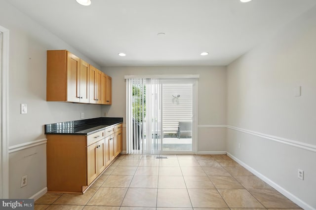 2512 Kitmore Ln, Bowie, MD 20715 - kitchen with dark countertops, recessed lighting, baseboards, and light tile patterned floors
