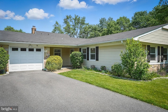 2512 Kitmore Ln, Bowie, MD 20715 - single story home with a garage, driveway, a chimney, a front yard, and stone siding