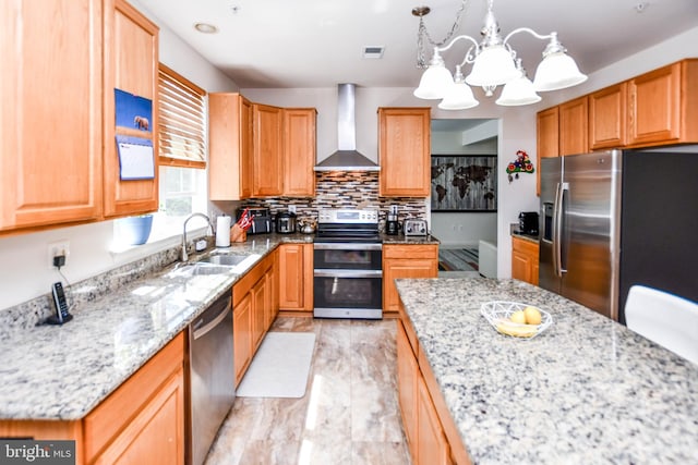 11212 Snowden Pond Rd, Laurel, MD 20708 - kitchen with wall chimney exhaust hood, appliances with stainless steel finishes, a sink, a chandelier, and light stone counters