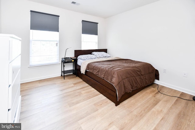 11212 Snowden Pond Rd, Laurel, MD 20708 - bedroom with light wood-style floors and baseboards