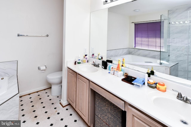 11212 Snowden Pond Rd, Laurel, MD 20708 - bathroom featuring double vanity, a garden tub, toilet, an enclosed shower, and baseboards