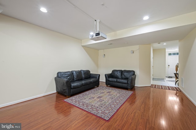 10745 Hillingdon Rd, Woodstock, MD 21163 - living room featuring wood finished floors, recessed lighting, and baseboards