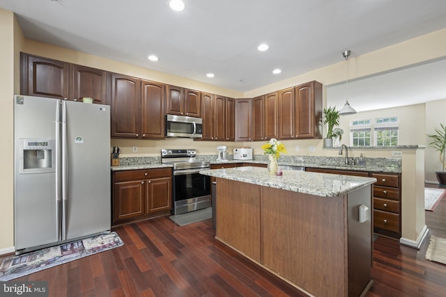 10745 Hillingdon Rd, Woodstock, MD 21163 - kitchen featuring appliances with stainless steel finishes, a sink, dark wood-type flooring, a kitchen island, and recessed lighting