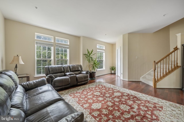 10745 Hillingdon Rd, Woodstock, MD 21163 - living room with healthy amount of natural light, wood finished floors, stairs, and baseboards