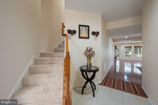 10745 Hillingdon Rd, Woodstock, MD 21163 - stairs with tile patterned flooring and baseboards