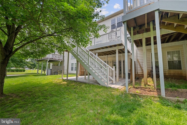 10745 Hillingdon Rd, Woodstock, MD 21163 - rear view of house featuring a lawn, a deck, stairs, and a patio area