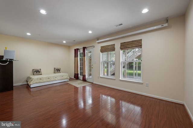 10745 Hillingdon Rd, Woodstock, MD 21163 - unfurnished living room featuring baseboards, wood finished floors, and recessed lighting