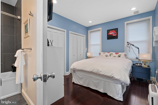1345 Pennsylvania Ave SE Unit 6, Washington, DC 20003 - bedroom featuring multiple closets, baseboards, wood-type flooring, multiple windows, and recessed lighting