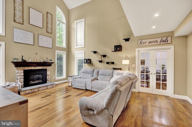 12 Fox Glen Dr, Reading, PA 19608 - living room with hardwood / wood-style floors, french doors, high vaulted ceiling, baseboards, and a fireplace