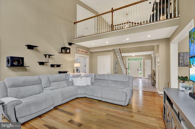 12 Fox Glen Dr, Reading, PA 19608 - living room featuring a high ceiling, light wood-style floors, stairway, recessed lighting, and baseboards