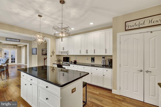 12 Fox Glen Dr, Reading, PA 19608 - kitchen featuring recessed lighting, wood finished floors, white cabinets, and a center island
