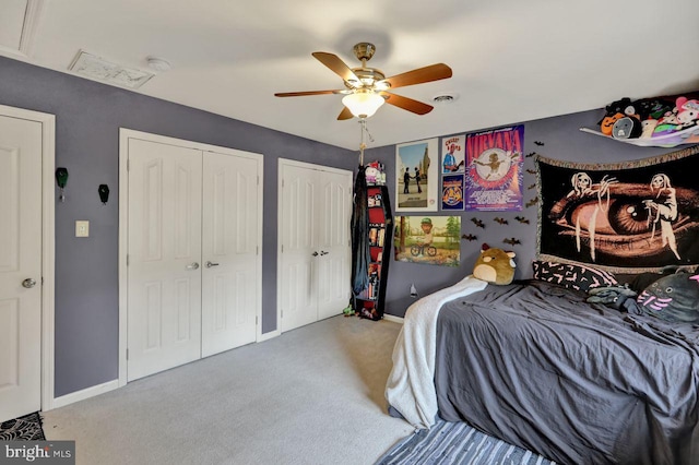 12 Fox Glen Dr, Reading, PA 19608 - carpeted bedroom featuring two closets, baseboards, and ceiling fan