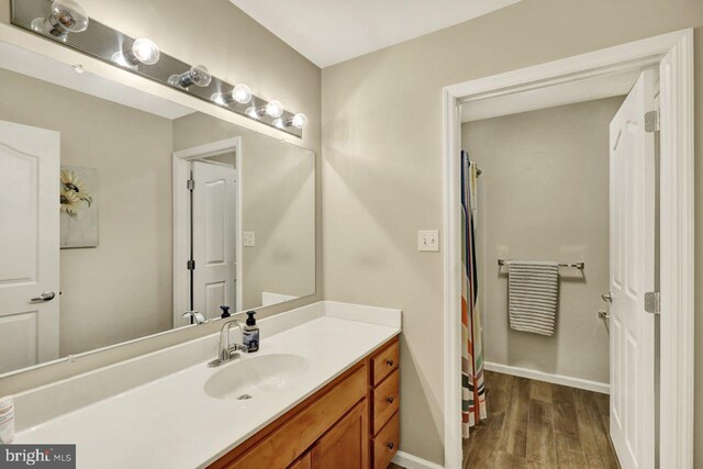 12 Fox Glen Dr, Reading, PA 19608 - bathroom with wood finished floors, vanity, and baseboards