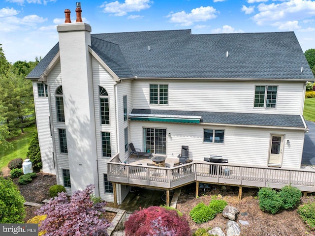 12 Fox Glen Dr, Reading, PA 19608 - back of property with a deck, a chimney, and roof with shingles