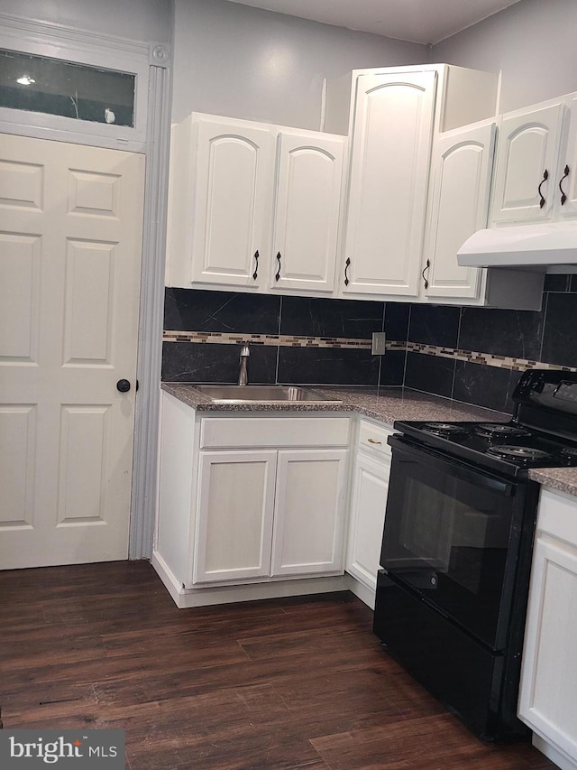 1218 Fidelity St, Reading, PA 19604 - kitchen featuring black / electric stove, a sink, white cabinetry, and backsplash