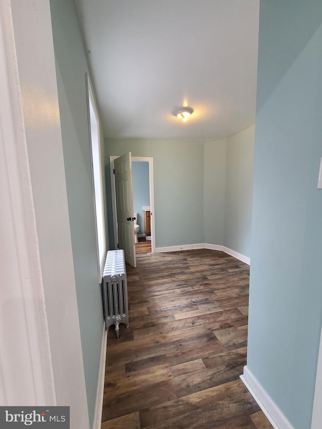 1218 Fidelity St, Reading, PA 19604 - spare room with radiator, dark wood finished floors, and baseboards
