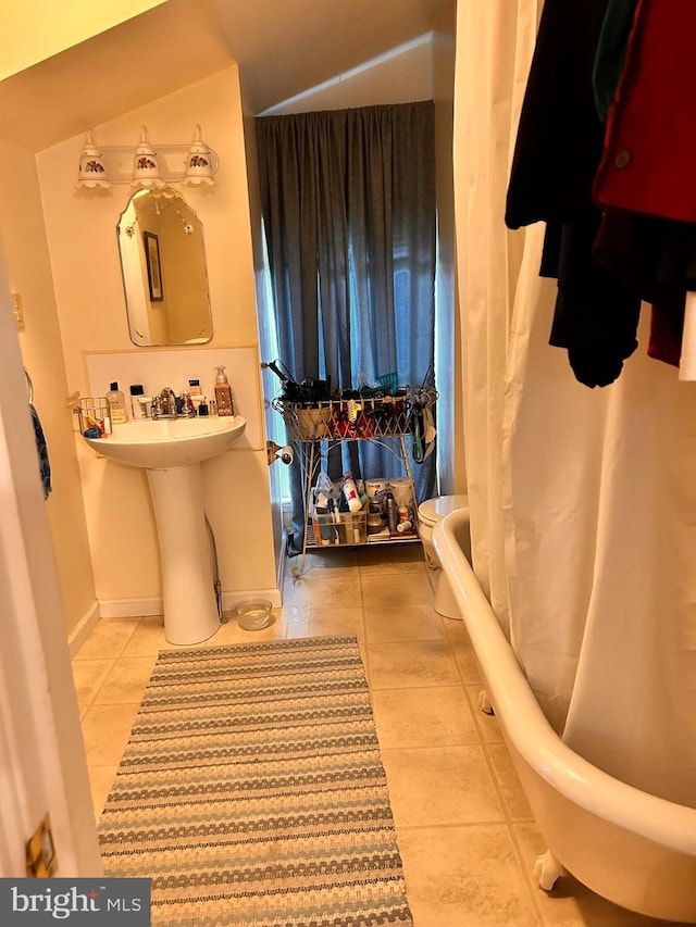 110-112 W Bishop St, Bellefonte, PA 16823 - full bathroom with tile patterned flooring, a sink, and shower / tub combo