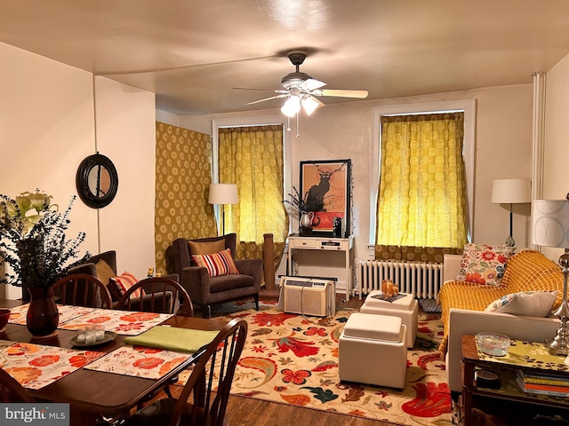110-112 W Bishop St, Bellefonte, PA 16823 - living room with radiator, wood finished floors, and ceiling fan
