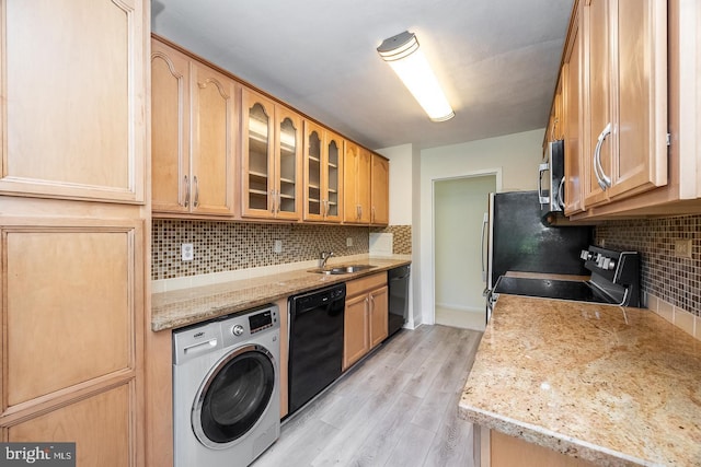 20 Conshohocken State Rd, Bala Cynwyd, PA 19004 - kitchen featuring washer / dryer, black dishwasher, electric range oven, and a sink