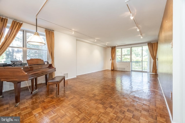 20 Conshohocken State Rd, Bala Cynwyd, PA 19004 - living room featuring rail lighting and baseboards