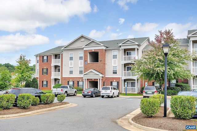 142 Yellowstone Dr Unit 006, Charlottesville, VA 22903 - view of building exterior featuring uncovered parking