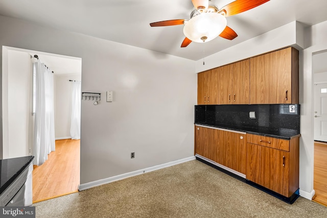 8320 Overmont, Parkville, MD 21234 - kitchen featuring ceiling fan, decorative backsplash, brown cabinets, and baseboards