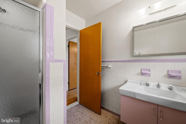 8320 Overmont, Parkville, MD 21234 - full bathroom featuring tile walls, vanity, tile patterned flooring, a stall shower, and wainscoting