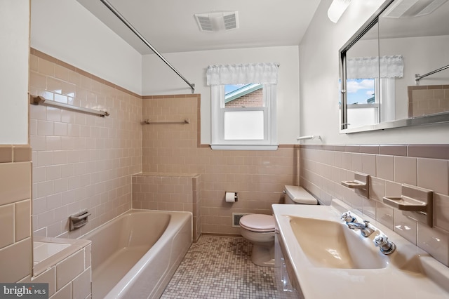 8320 Overmont, Parkville, MD 21234 - bathroom featuring a sink, tile walls, toilet, washtub / shower combination, and tile patterned floors