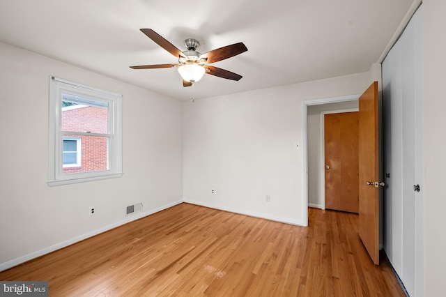 8320 Overmont, Parkville, MD 21234 - unfurnished room featuring light wood-style flooring, baseboards, and a ceiling fan