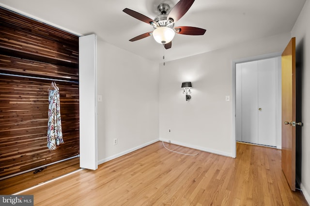 8320 Overmont, Parkville, MD 21234 - unfurnished room with a ceiling fan, light wood finished floors, and baseboards