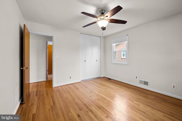 8320 Overmont, Parkville, MD 21234 - unfurnished bedroom featuring light wood finished floors, baseboards, a closet, and ceiling fan