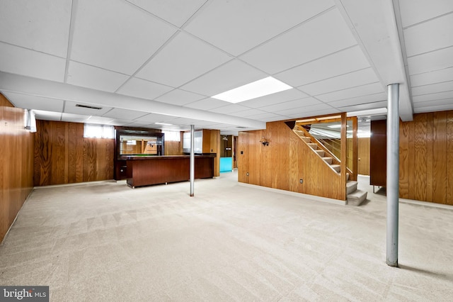 8320 Overmont, Parkville, MD 21234 - basement with a bar, stairway, wood walls, light carpet, and a paneled ceiling