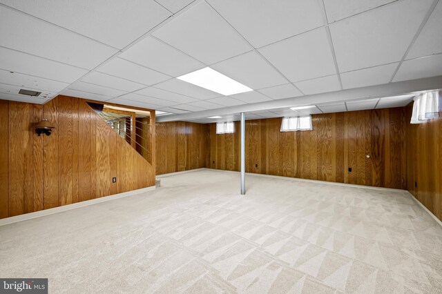 8320 Overmont, Parkville, MD 21234 - basement featuring stairs, wood walls, a paneled ceiling, and carpet flooring