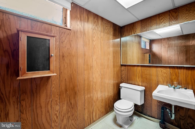 8320 Overmont, Parkville, MD 21234 - half bathroom featuring toilet, wooden walls, and plenty of natural light
