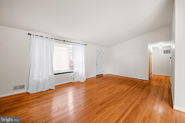 8320 Overmont, Parkville, MD 21234 - empty room featuring light wood finished floors, lofted ceiling, and baseboards